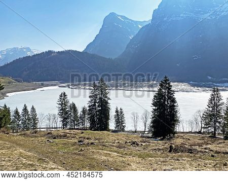 Frozen Klöntalersee Or Klontaler Lake During Early Spring In The Alpine Valley Klöntal (kloental Or 