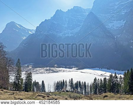 Frozen Klöntalersee Or Klontaler Lake During Early Spring In The Alpine Valley Klöntal (kloental Or 