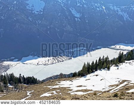 Frozen Klöntalersee Or Klontaler Lake During Early Spring In The Alpine Valley Klöntal (kloental Or 