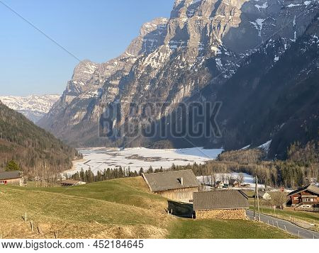 Frozen Klöntalersee Or Klontaler Lake During Early Spring In The Alpine Valley Klöntal (kloental Or 