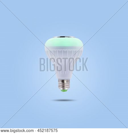 Green Color Led Energy Saving Lamp 230v Isolated On Blue Pastel Color Background.