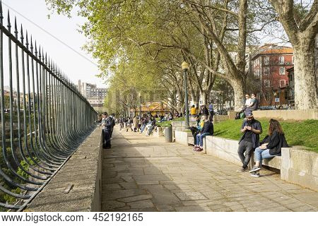 Porto, Portugal. March 2022.  People Relax Admiring The Panorama Of The City On The Virtudes Park