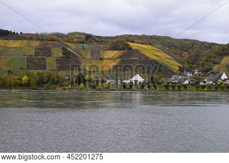 Waterfront Of Leutesdorf At The Rhine With Autumn Vineyards Above