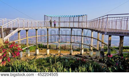 Tourist Enjoying Beautiful View From Top Of Nandi Hills