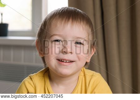 Child Boy With Blonde Hair Baby Looking At Camera. Portrait 3 Years Old Kid. Boy Toddler At Home. Ea