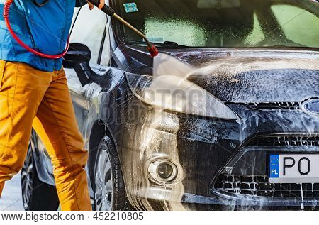 A Vehicle In A Coin-operated Self-service Car Wash