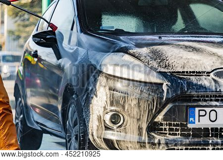 A Vehicle In A Coin-operated Self-service Car Wash