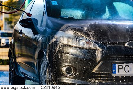 A Vehicle In A Coin-operated Self-service Car Wash