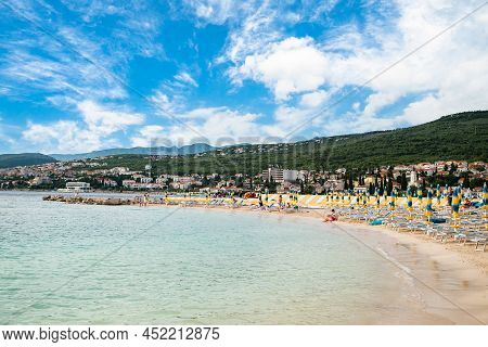 Selce. Croatia July 20, 2021. Sandy Beach With People. The Beginning Of A Vacation At Sea.
