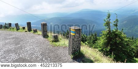 Colorful Sign For Bike Tourism Painted On The Stone Bollard On Tourist Path To Vrbatova Bouda In Krk