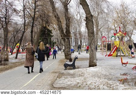 Engels, Russia- April 02, 2018: People Walk In The City Park. Russia, Saratov, Engels.
