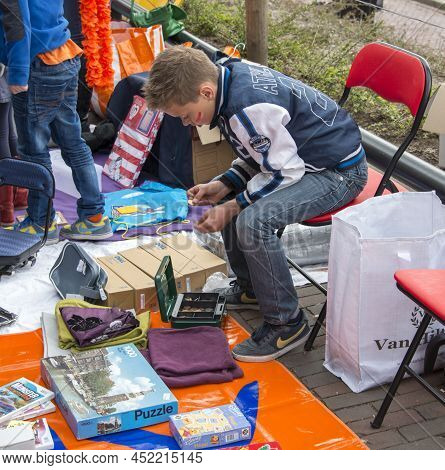 Melissant, Holland - April 30 Unidentified Boy Countinh His Money Earned From Sale On The Market On 