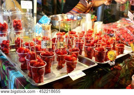 Fresh Strawberry Fruits Packed In Disposable Glasses. Disposable Glasses Placed In Trey. Price Tags 