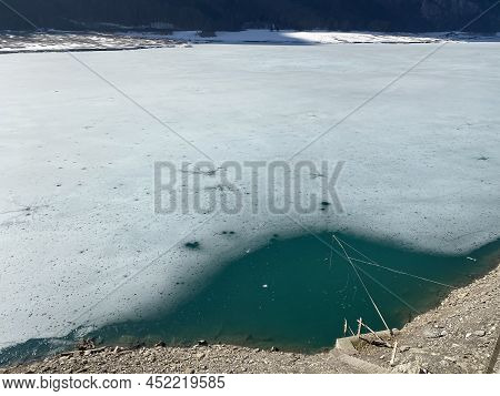 Thawing A Frozen Lake Klöntalersee Or Klontaler Lake During Early Spring In The Alpine Valley Klönta
