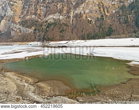 Thawing A Frozen Lake Klöntalersee Or Klontaler Lake During Early Spring In The Alpine Valley Klönta