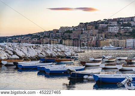 Wiew Over Fish Boats Embarked In The Bay Of Napoli On A Gloomy Spring Evening. Napoli Waterfront Wit