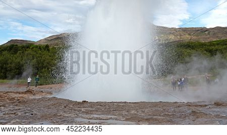 Geysir, Iceland - July 28, 2021: Geyser Strokkur In Iceland Errupting With Hot Water And Steam, Each