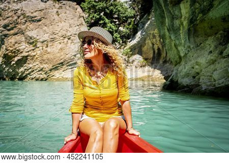 Cute Adult Tourist Woman Enjoy Outdoor Leisure Activity Sith Kayak Experience Tour On A Blue Clean W