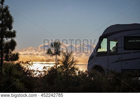 Travel People Lifestyle And Nomadic Life With White Camper Van Motorhome And Beautiful Colorful Suns