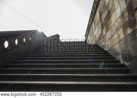 Porto, Portugal. March 2022.  The View Of A Backlit Staircase In The Historic Center Of The City.