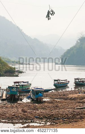 The Landscape Of The Nam U River And Passenger Boats At A Local Pier In The Evening. Phongsaly, Nort