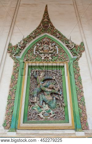 Picturesque Exterior Of The Ancient Buddhist Temple, The Stucco Tracery Of Narayana Bends His Bow On