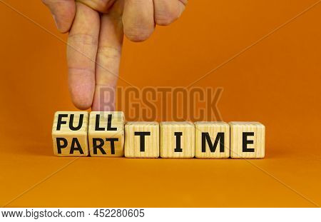 Full Or Part Time Symbol. Businessman Turns Wooden Cubes And Changes Words 'full-time' To 'part-time