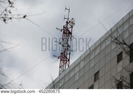 Television Information Receiver On The Roof Of The Building. Antenna For Internet And Tv