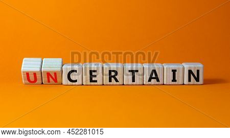 Certain Or Uncertain Symbol. Turned Wooden Cubes And Changed The Concept Word Uncertain To Certain. 
