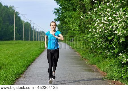 Running Woman Atletic Spotsman Training In The Summer Park. Outdoor Fitness Portrait