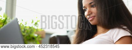 Portrait Of Concentrated Latino American Young Woman Working On Laptop. Girl Typing On Keyboard Prep
