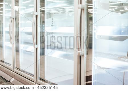 Empty Refrigerator Or Freezer For Food And Grocery Items In Store. Selective Focus.
