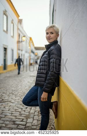 Portrait Of Blond Modern Woman In Urban Settings