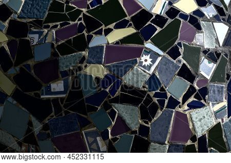 Wall Decoration With Ceramic Mosaics Of Bright Colors And Unequal Sizes.