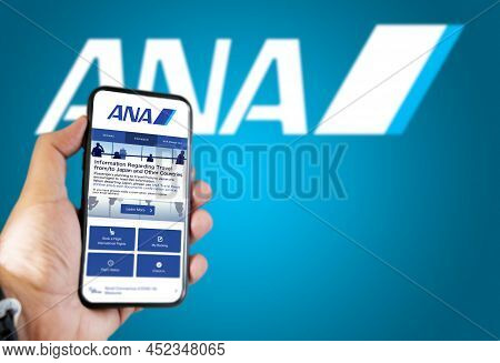 Tokyo, , January 2022: Hand Holding A Phone With Ana All Nippon Airways Flight Booking Application. 
