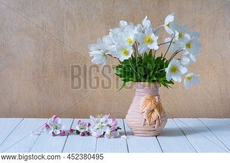 Bouquet Of White Wildflowers In A Vase On A White Wooden Table. Still Life. Anemone Sylvestris