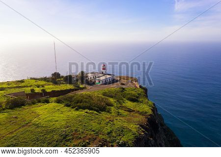 Aerial View Of The Ponta Do Pargo Lighthouse Located On A Massive Cliff In The Madeira Islands, Port