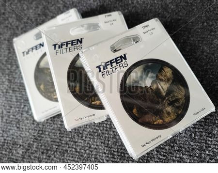 04.10.2021 Warsaw, Poland. Three Packed Tiffen Promist Filters Over Textured Grey Background. High Q