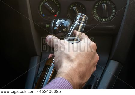 Man Drinking Alcohol While Driving In His Car.