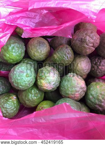 Bunch Of Kaffir Lime Fruits In A Plastic Bag