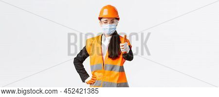 Covid-19 Safety Protocol At Enterpise, Construction And Preventing Virus Concept. Confident Asian Fe