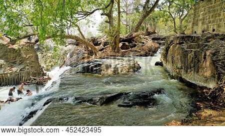 Hogenakkal,tamilnadu,india-march 19 2022: Tourists Taking Bath In Hogenakkal Falls. Hogenakkal Falls