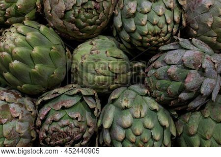 Artichokes On The Shelf In The Market For Backdrop