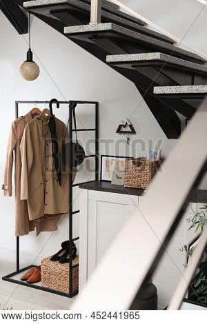 Modern Hallway Interior With Stylish Furniture And Key Holder