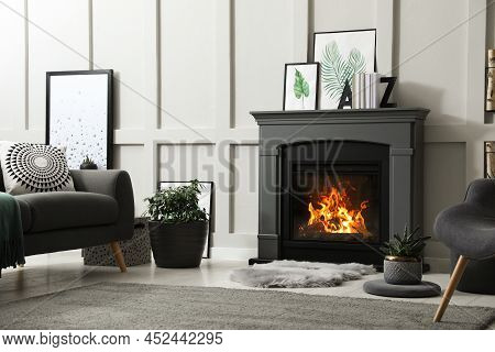 Stylish Living Room Interior With Electric Fireplace And Comfortable Furniture