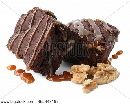 Delicious Chocolate Brownies With Nuts And Caramel Sauce On White Background