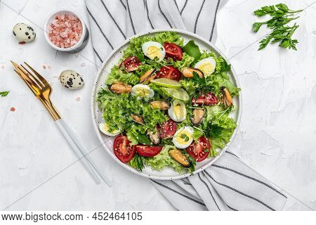 Fresh Salad With Mussels, Quail, Egg, Conjugate, Lime, Spinach, Lettuce, Cherry Tomatoes And Microgr