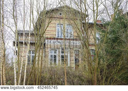 Old Railroad Station Building Behind Bare Birch Trees In Schonberg, Mecklenburg, One Of Many Closed 