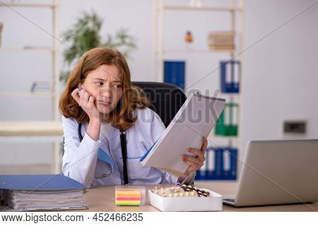 Young female doctor workiing in the clinic