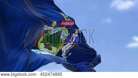 The Us State Flag Of Maine Waving In The Wind. Maine Is A State In The New England Region Of The Uni